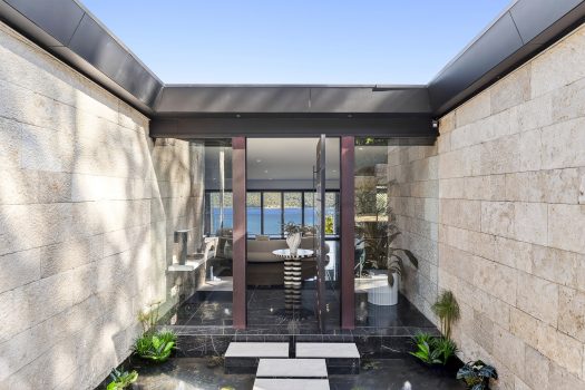 Modern home entry with ocean view.