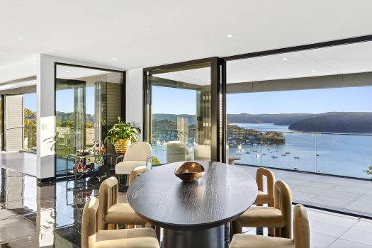 Modern room overlooking scenic harbour view.